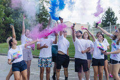 IU Southeast students throw up chalk to kick off color wars.
